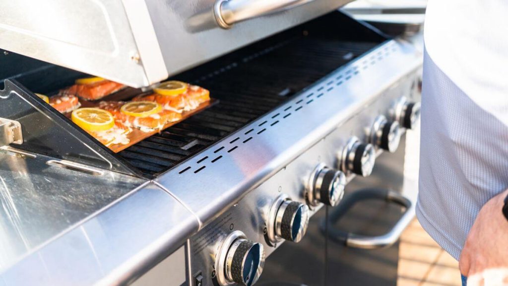 How do you start a gas grill manually?